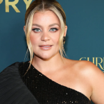 Lauren Alaina smiling on the red carpet at the ACM Awards.
